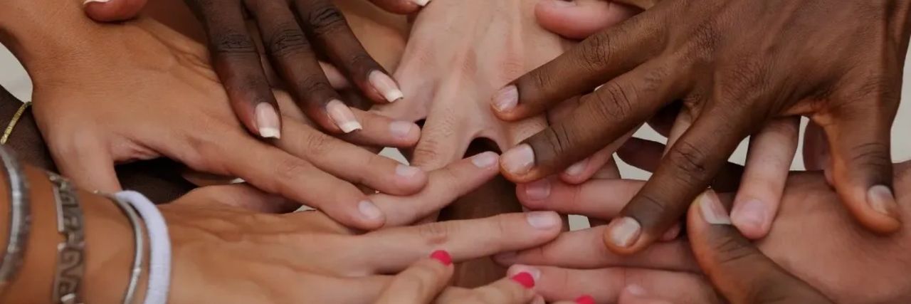 Group of hands in the middle