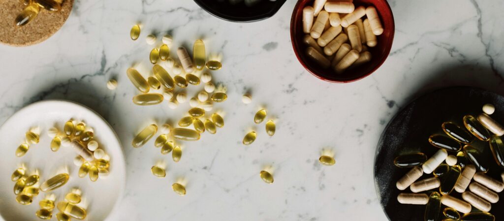 Multivitamins splayed across a marble counter