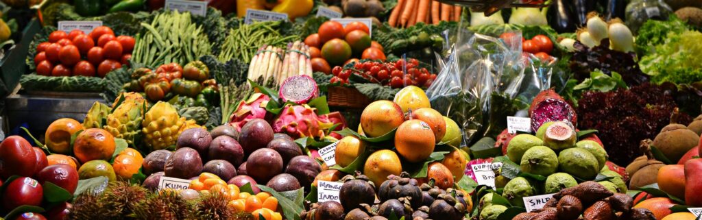 Vegetables and fruits under soft lighting